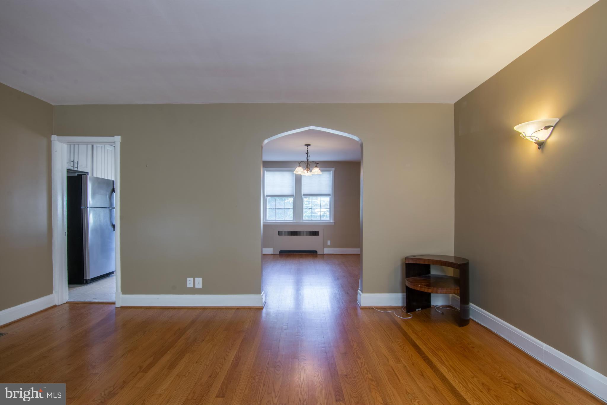 74 Murdock Road Baltimore, MD 21212 - Photo 9 of 30 a view of empty room with wooden floor and fan