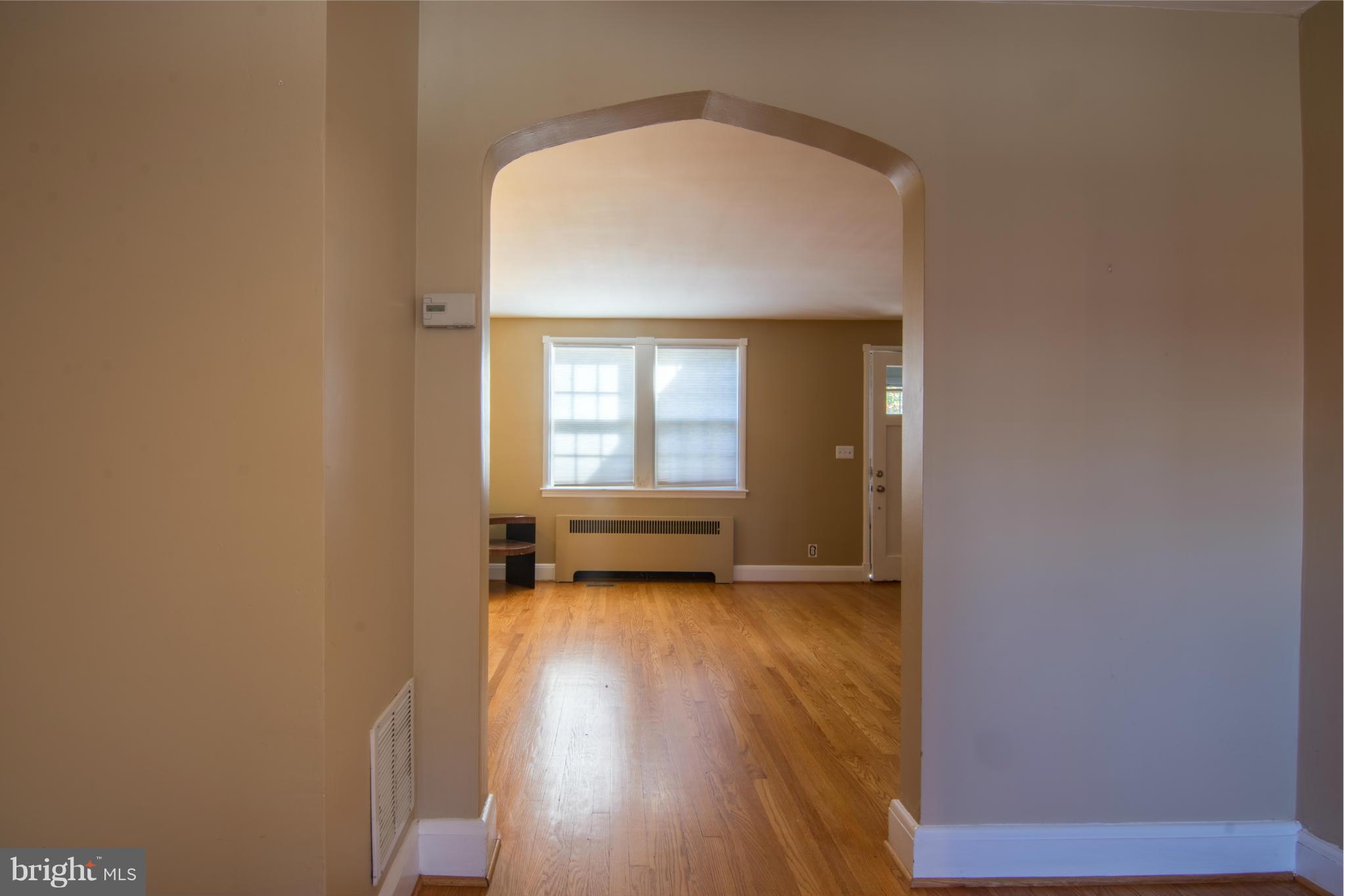 74 Murdock Road Baltimore, MD 21212 - Photo 10 of 30 a view of a room with wooden floor and a window