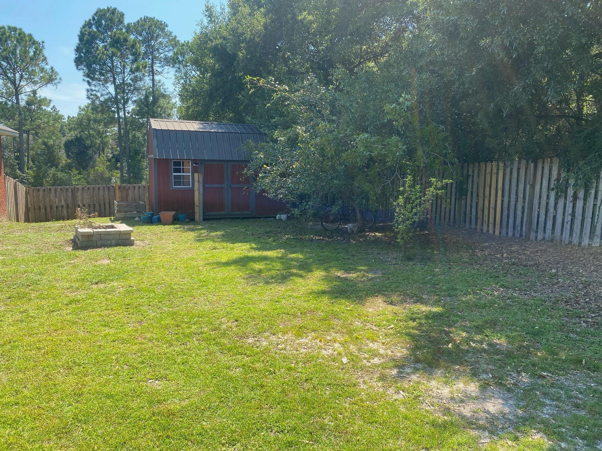 421 Swift Fox Run Crestview, FL 32536 - Photo 13 of 35 Shed and Firepit and Mostly Privacy Fenc