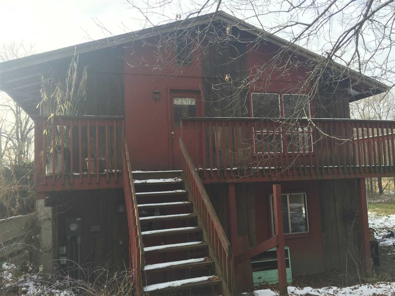 8775 Pomeroy Road Rockton, IL 61072 - Photo 2 of 12 a front view of a house with wooden stairs