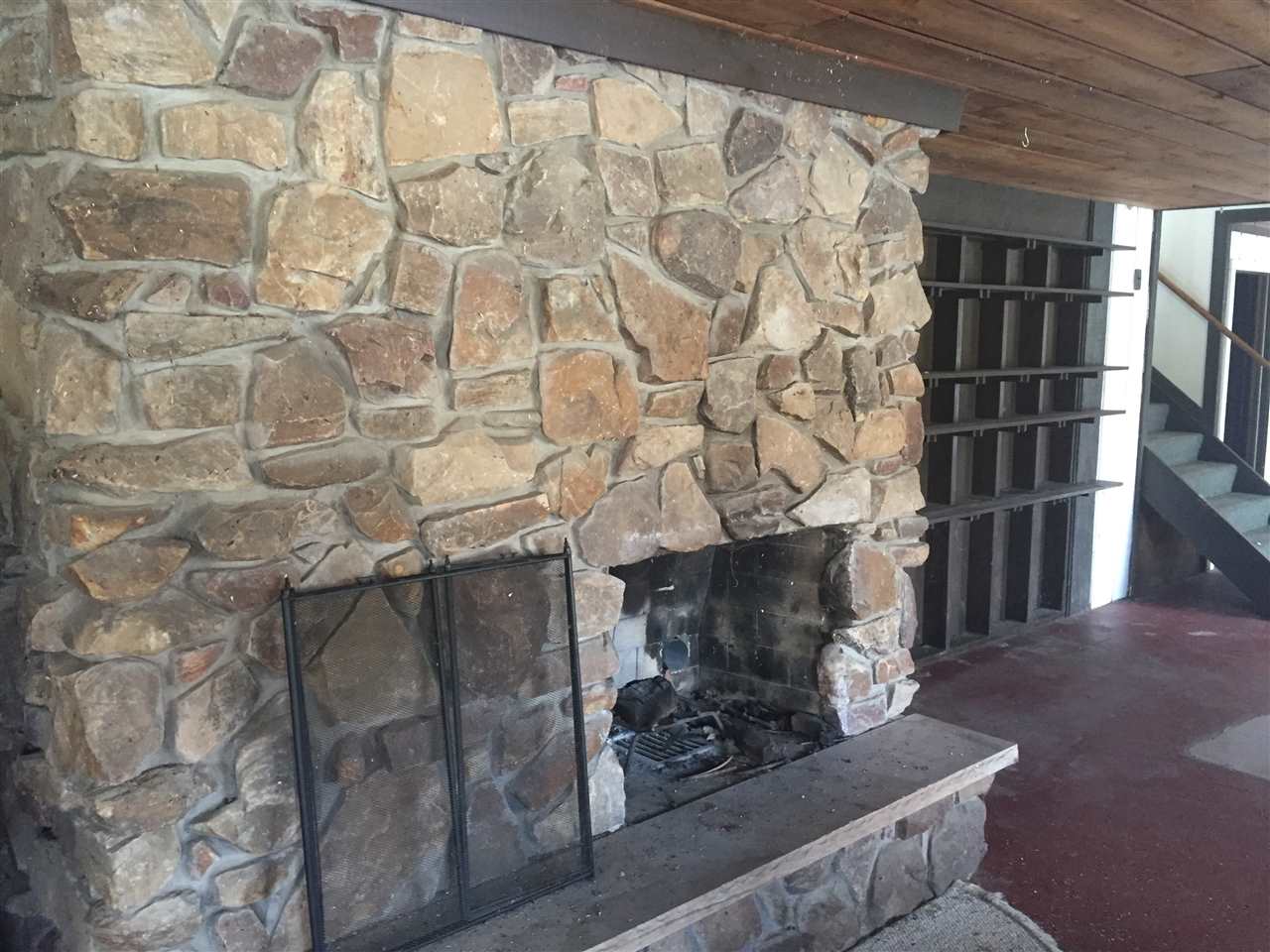 8775 Pomeroy Road Rockton, IL 61072 - Photo 3 of 12 a living room with a fireplace