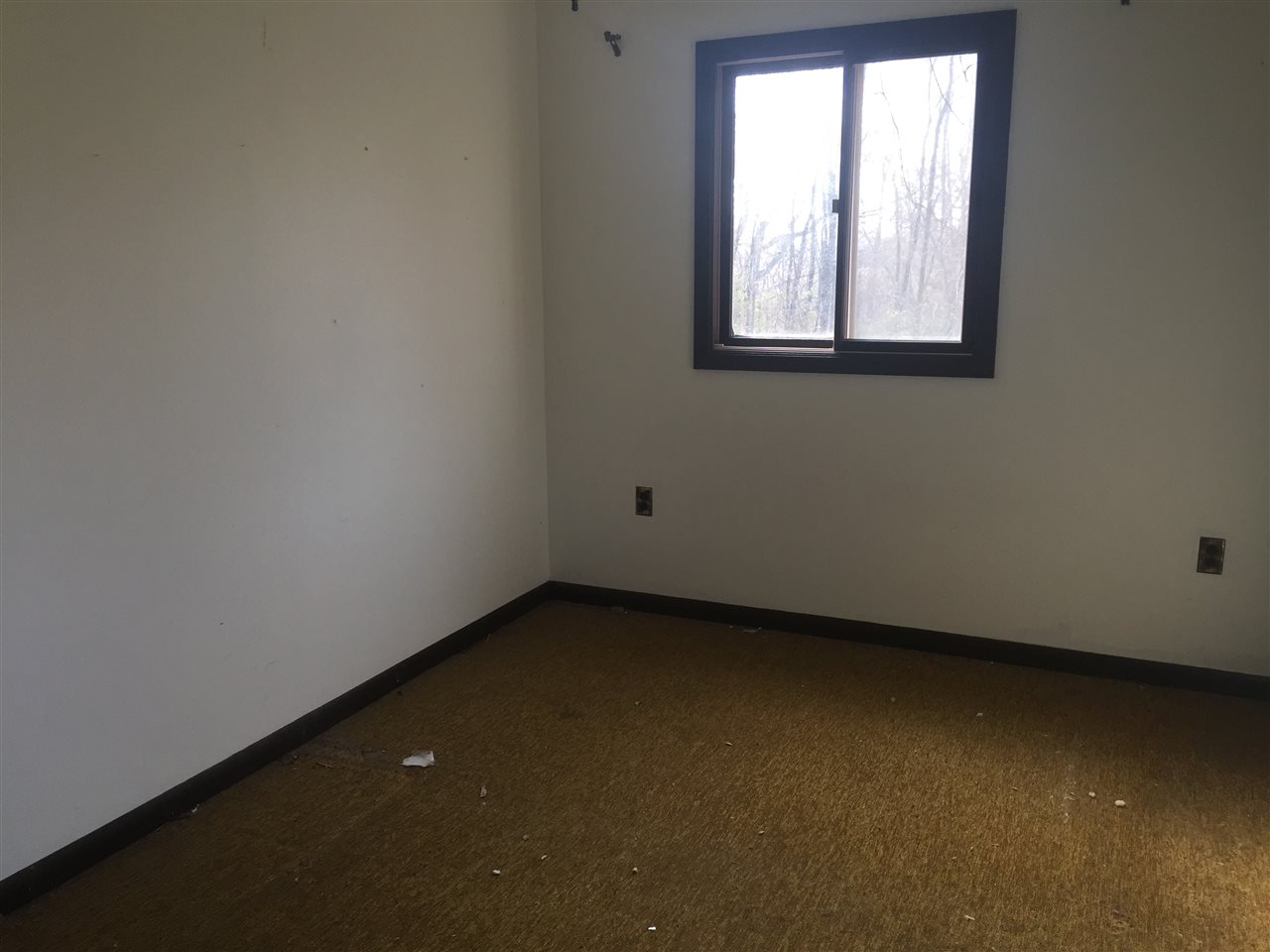 8775 Pomeroy Road Rockton, IL 61072 - Photo 9 of 12 an empty room with a window