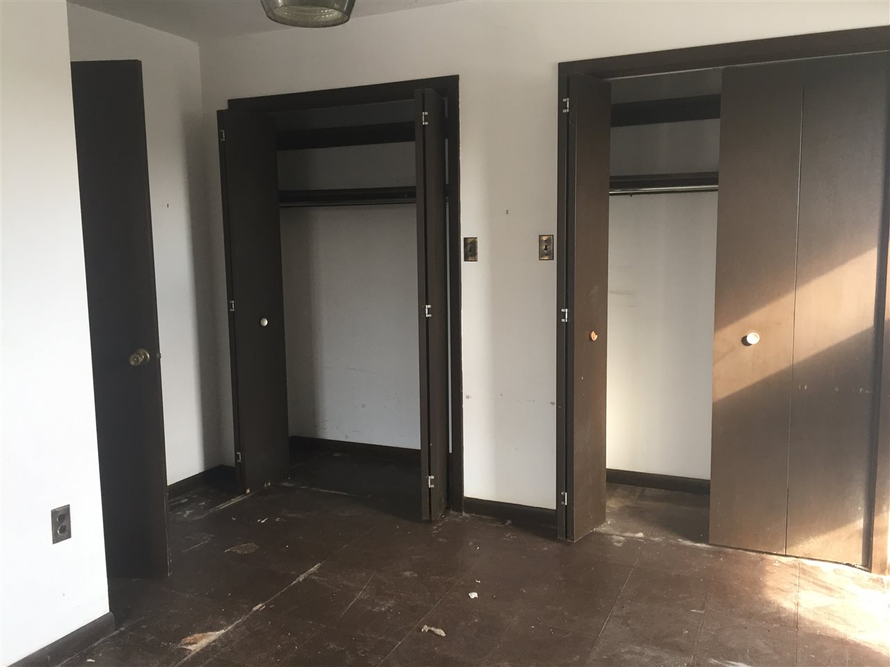 8775 Pomeroy Road Rockton, IL 61072 - Photo 10 of 12 an empty room with a door and a closet