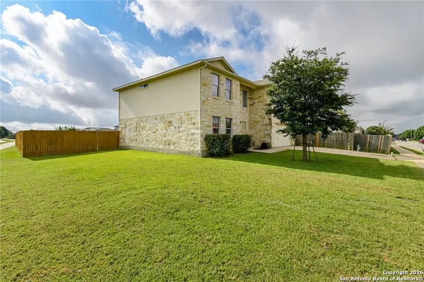 a view of a house with a yard