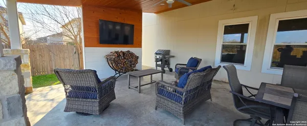 a view of a patio with couple of chairs