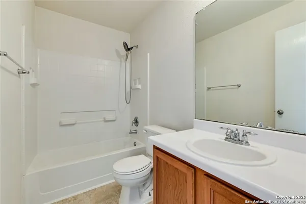 a bathroom with a sink a toilet and a bathtub