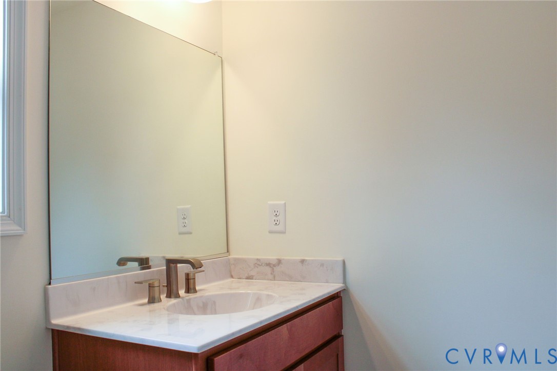 11632 Fort Cosby Drive Midlothian, VA 23112 - Photo 9 of 9 a bathroom with a sink and a mirror