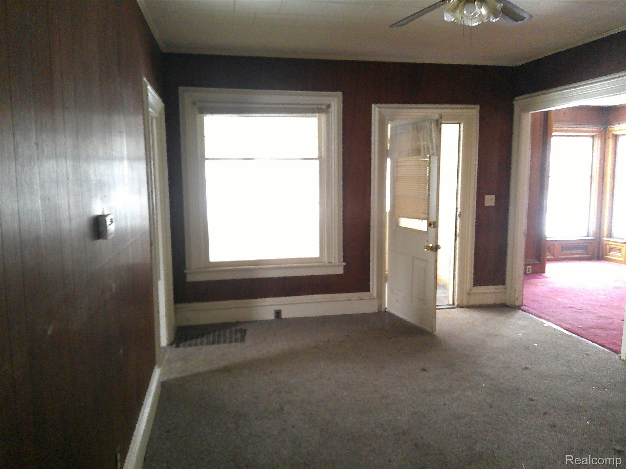 8405 North Vassar Road Mount Morris, MI 48458 - Photo 6 of 18 Living room with carpet, healthy amount of natural light, and ceiling fan