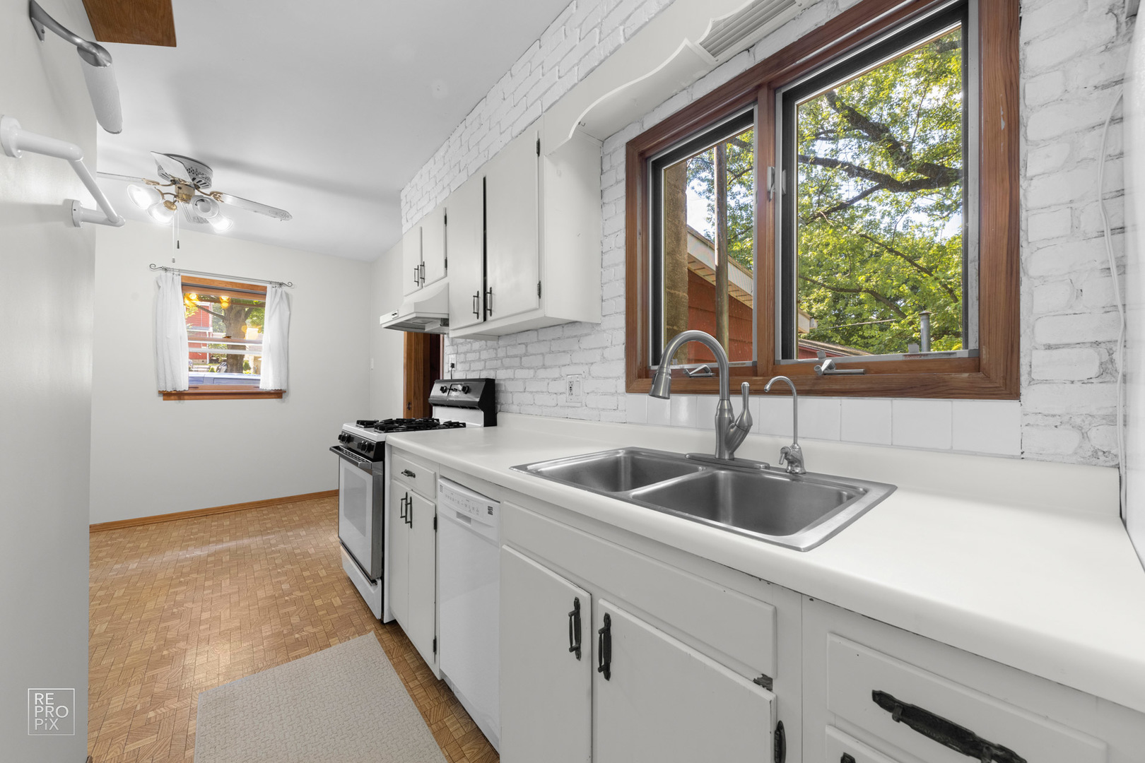 1382 Raymond Street South Elgin, IL 60177 - Photo 6 of 14 a kitchen with a sink and a window