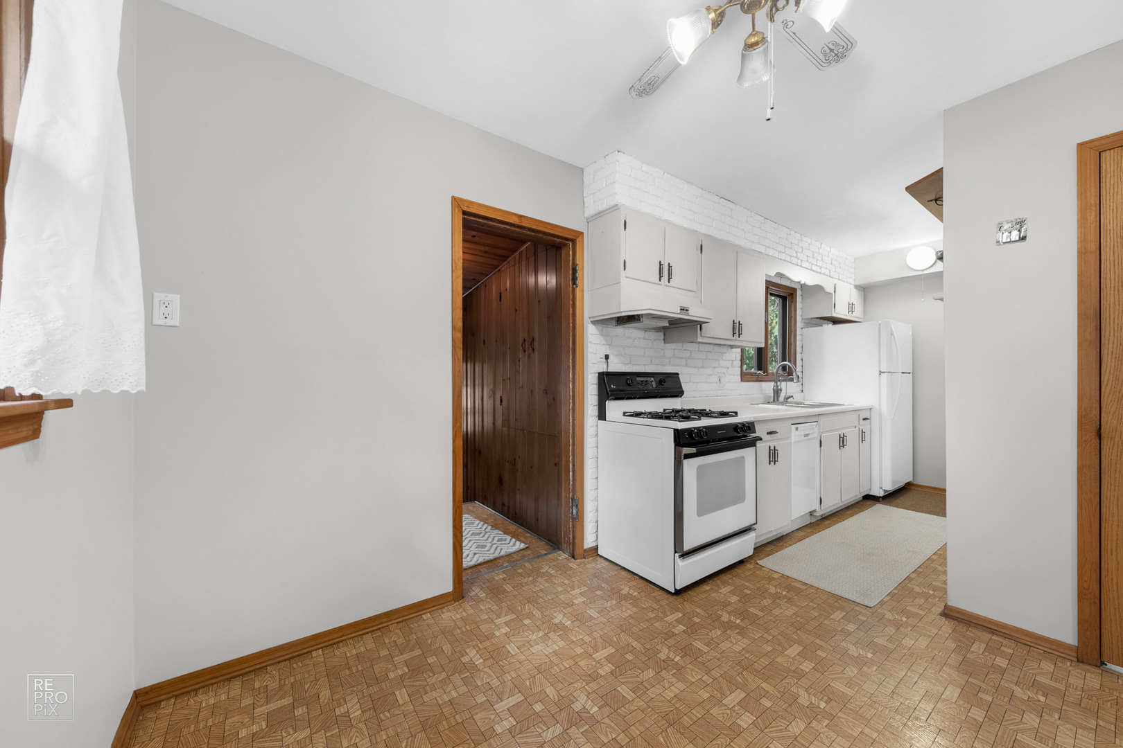 1382 Raymond Street South Elgin, IL 60177 - Photo 8 of 14 a kitchen with stainless steel appliances a refrigerator a sink a stove top oven a large window
