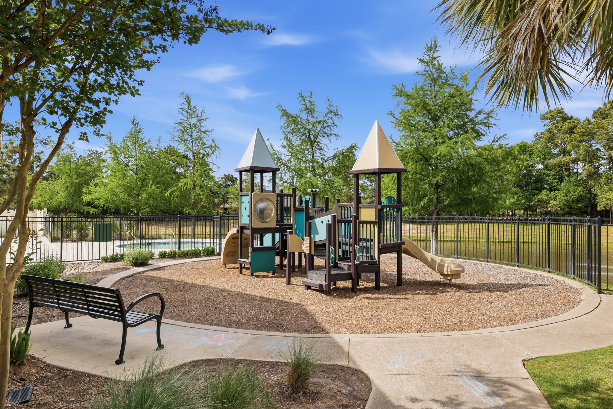 8169 Tranquil Lake Way Conroe, TX 77385 - Photo 24 of 26 a view of a backyard with a patio