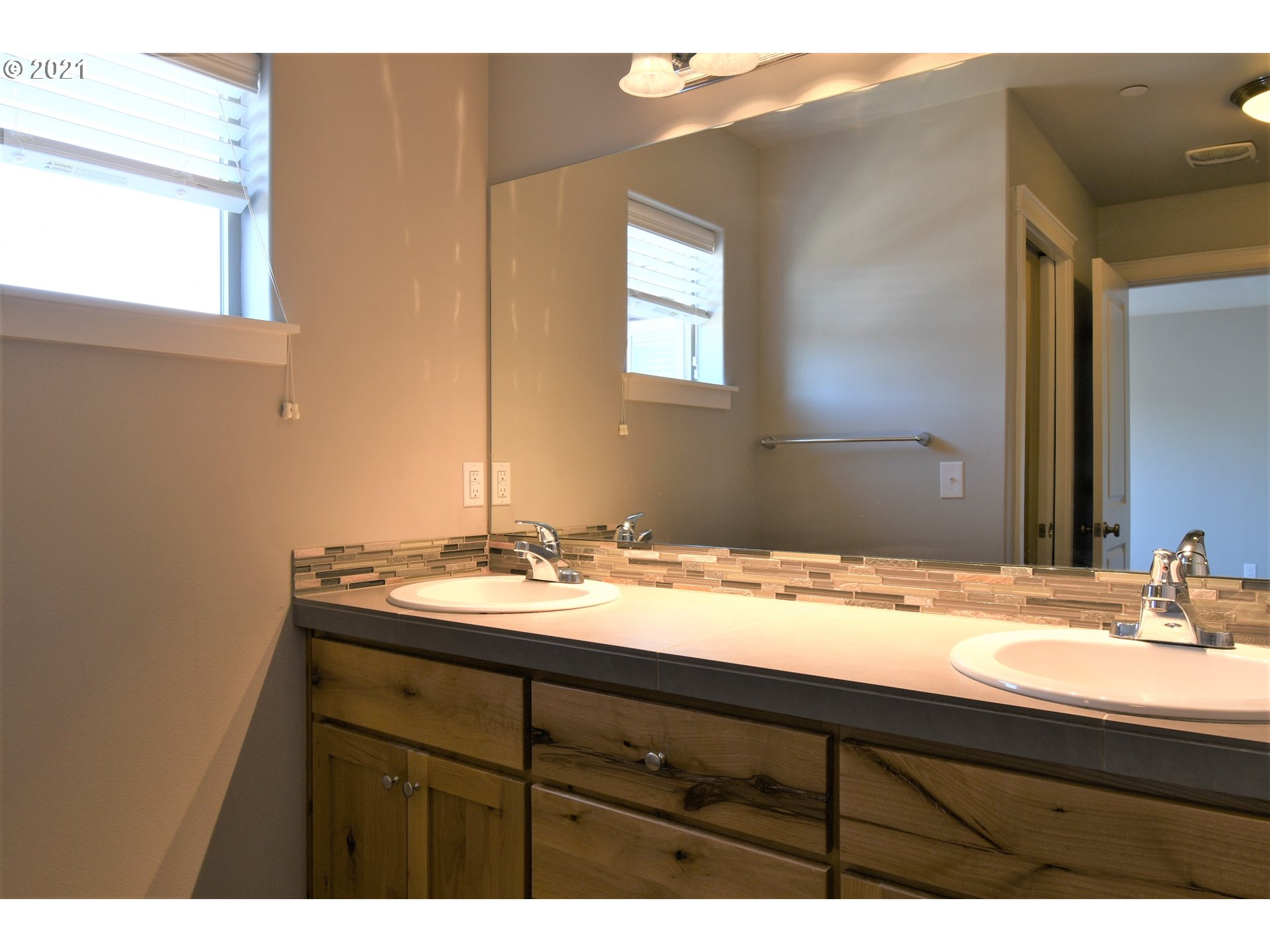 100 North 44th Place Ridgefield, WA 98642 - Photo 14 of 21 a bathroom with a sink and a mirror