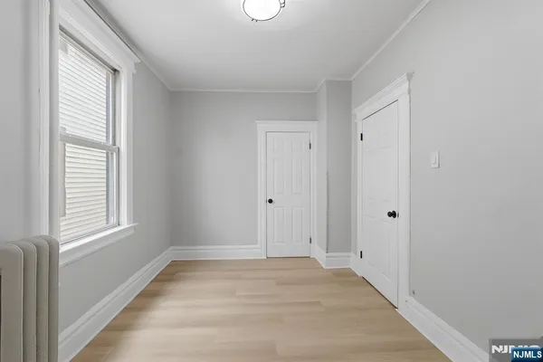 a view of a livingroom with wooden floor