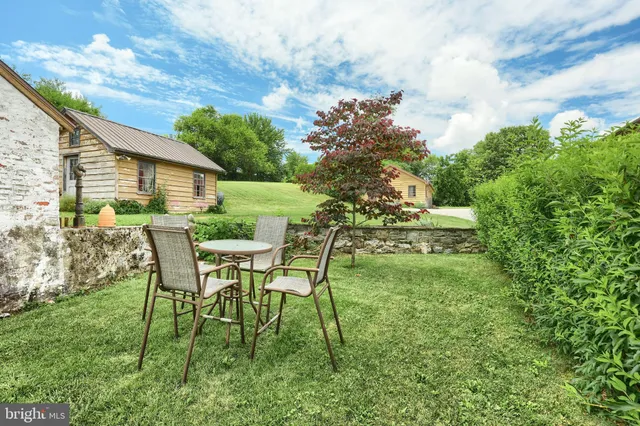 a living room with furniture fireplace and a flat screen tv