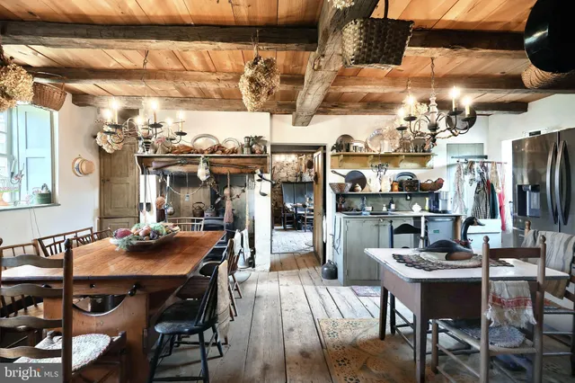 a kitchen with stainless steel appliances granite countertop a sink and a refrigerator