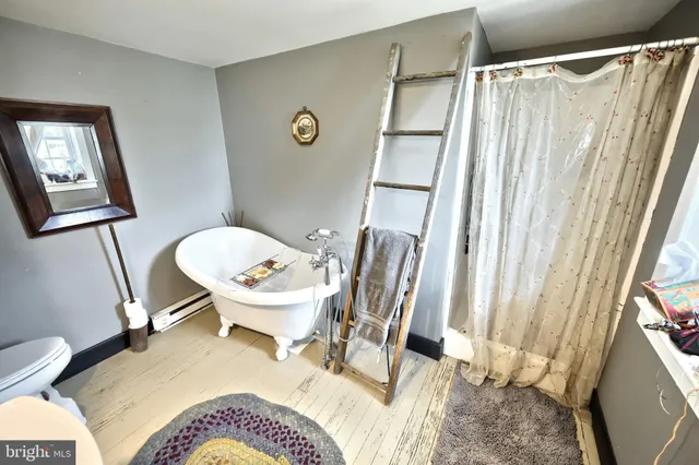 a bedroom with a bed and a fireplace