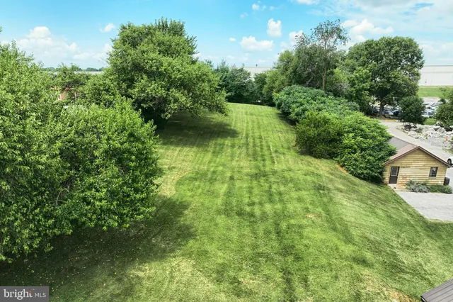 a view of a lake with a yard