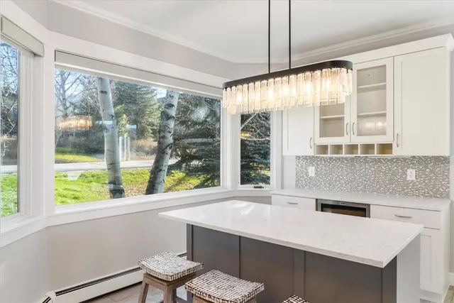 a kitchen with a sink and a large window