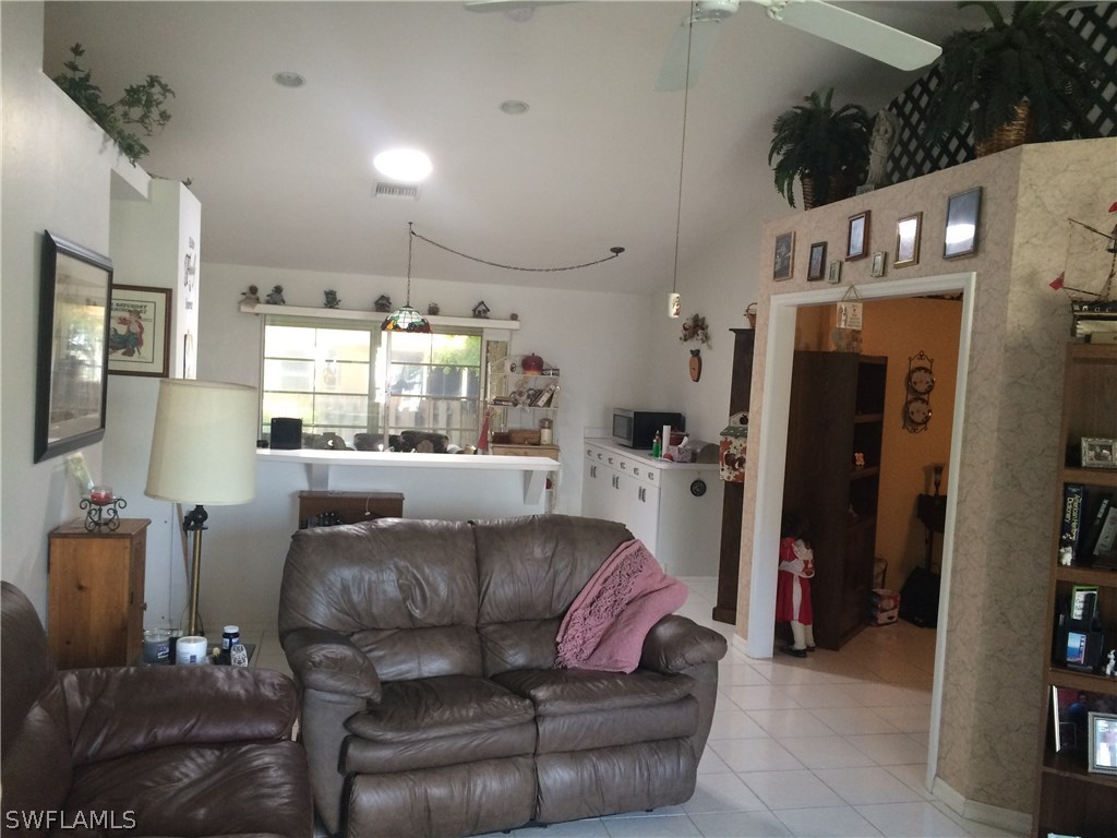 8288 Bahamas Road Fort Myers, FL 33967 - Photo 12 of 23 a living room with furniture and a window