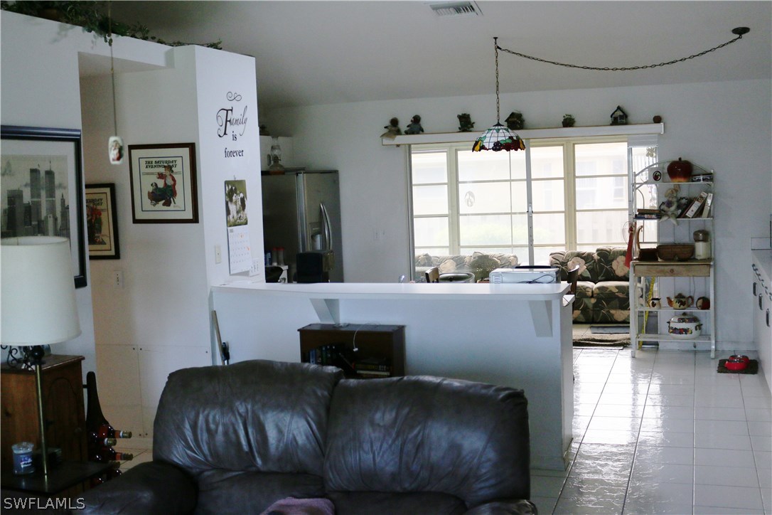 8288 Bahamas Road Fort Myers, FL 33967 - Photo 13 of 23 a living room with furniture and a window