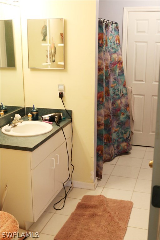 8288 Bahamas Road Fort Myers, FL 33967 - Photo 14 of 23 a bathroom with a sink mirror and vanity