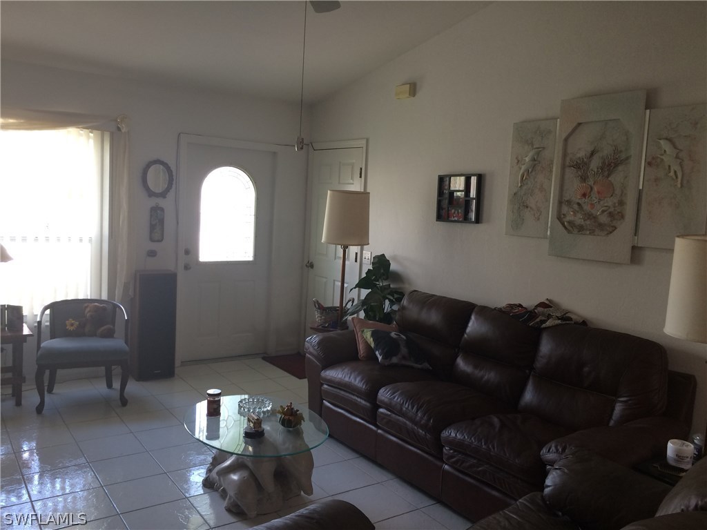 8288 Bahamas Road Fort Myers, FL 33967 - Photo 9 of 23 a living room with furniture and a potted plant