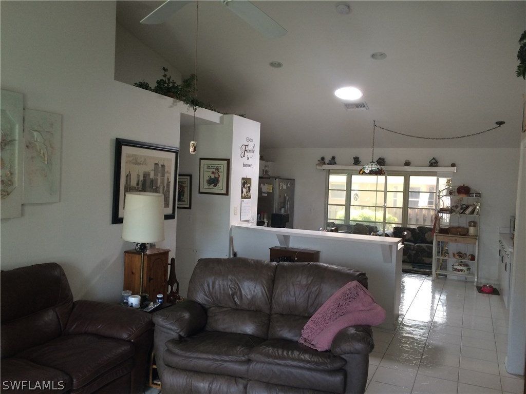 8288 Bahamas Road Fort Myers, FL 33967 - Photo 10 of 23 a living room with furniture and a large window