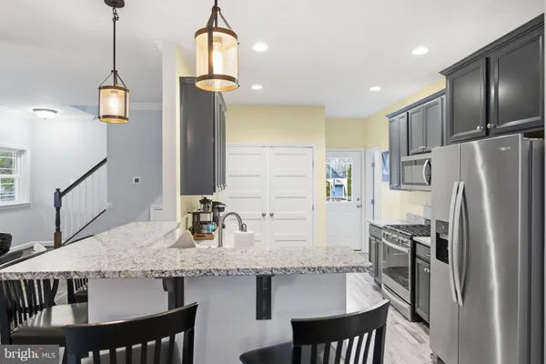 a living room with lots of furniture and a wooden floor