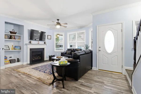 a kitchen with stainless steel appliances granite countertop a stove refrigerator and microwave