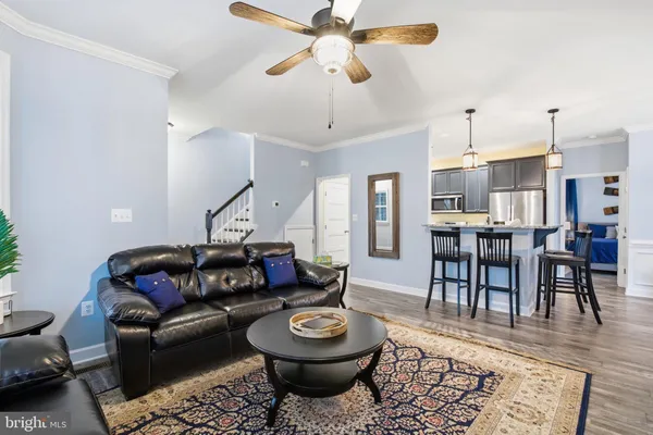 a living room with furniture fireplace and a flat screen tv