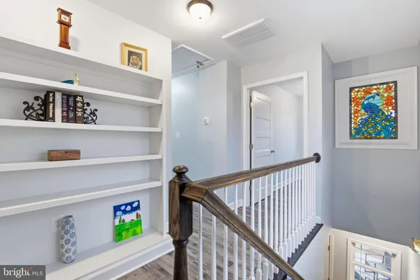 a bathroom with a double vanity sink mirror and bathtub