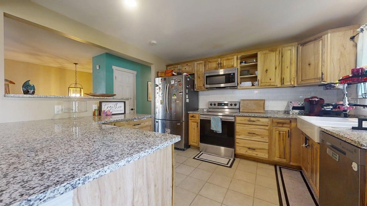 2605 Trafalgar Square Champaign, IL 61821 - Photo 11 of 42 a kitchen with stainless steel appliances granite countertop a stove a sink and a microwave