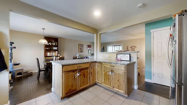 a kitchen with a stove sink and cabinets