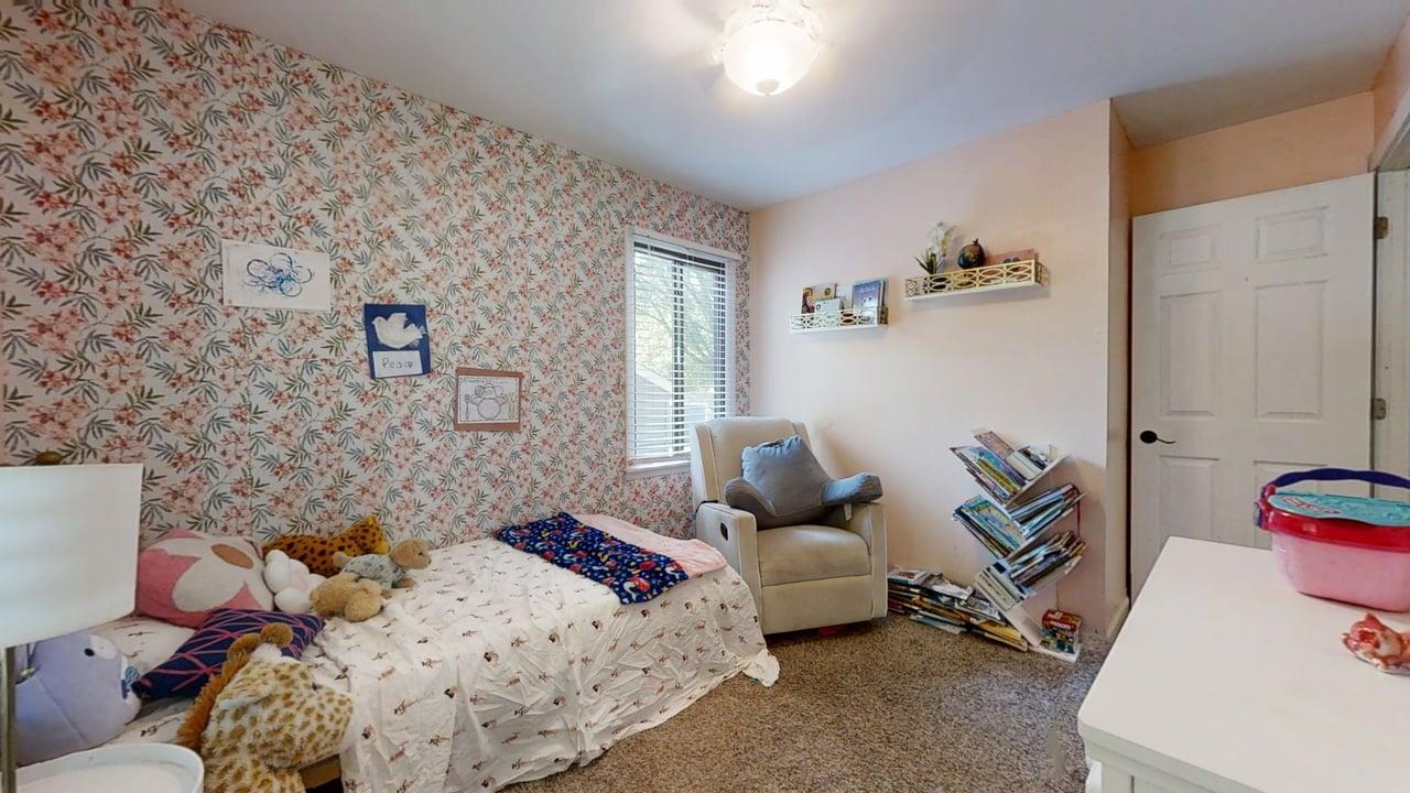 2605 Trafalgar Square Champaign, IL 61821 - Photo 19 of 42 a bedroom with a bed and wooden floor