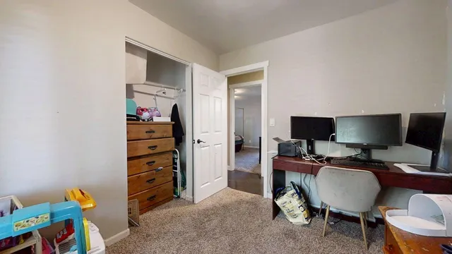 a view of a workspace with furniture