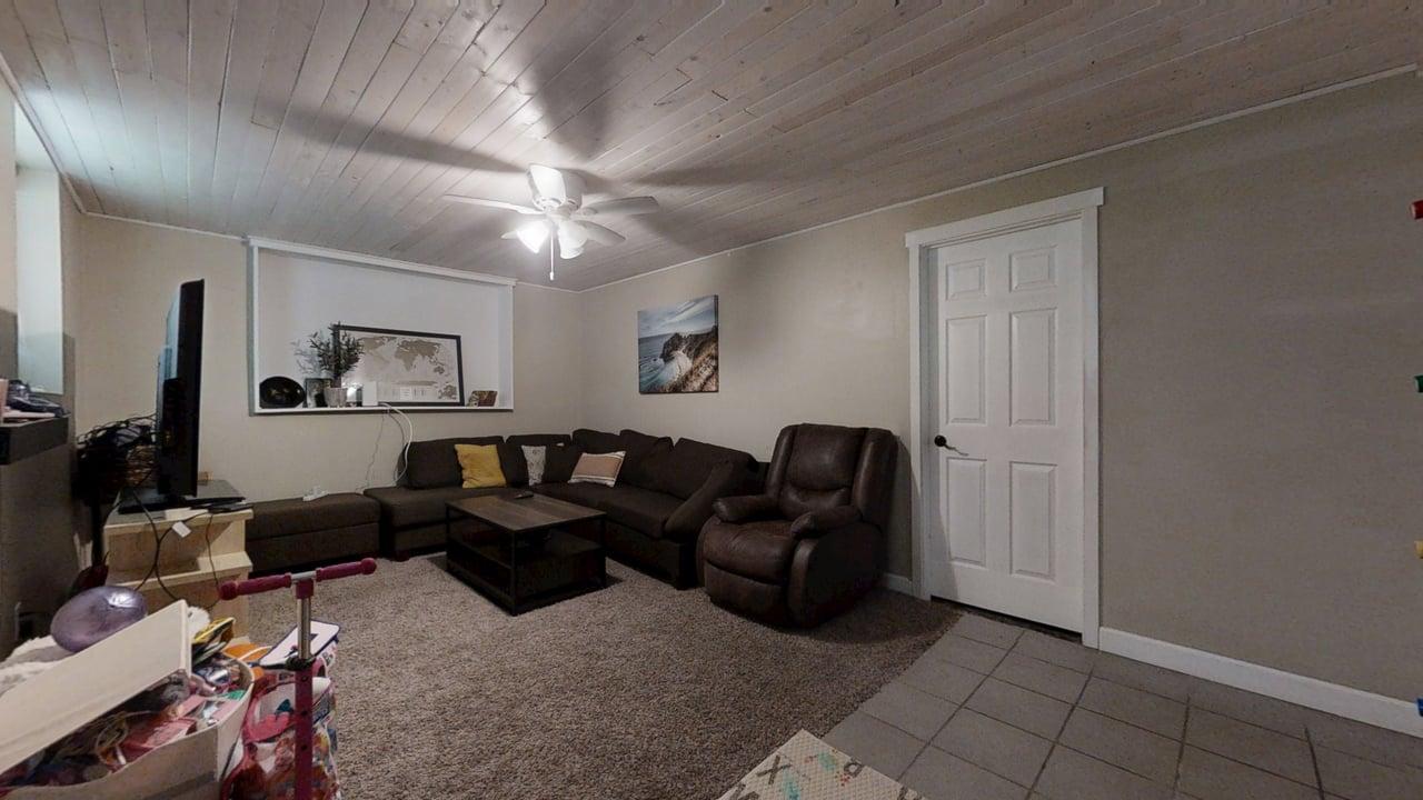 2605 Trafalgar Square Champaign, IL 61821 - Photo 26 of 42 a living room with furniture a ceiling fan and a rug