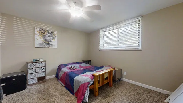 a bedroom with a bed and a couch