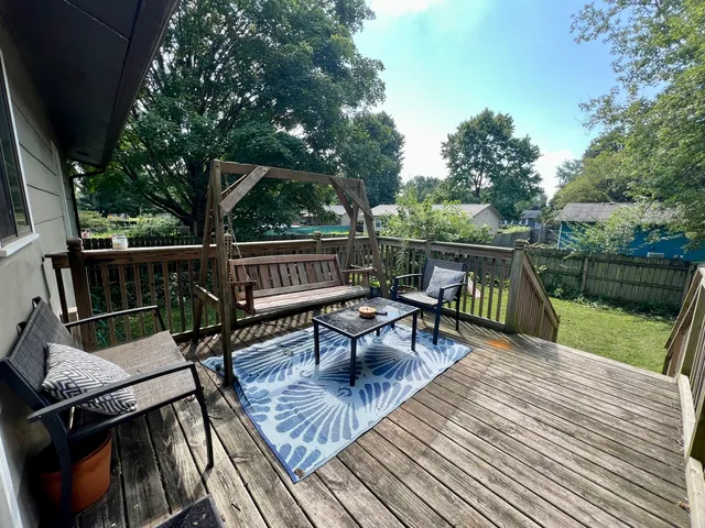 a roof deck with a table and chairs