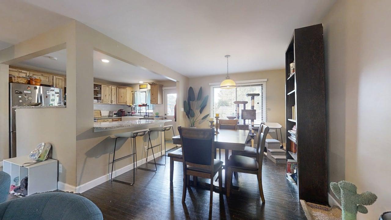 2605 Trafalgar Square Champaign, IL 61821 - Photo 7 of 42 a view of a dining room with furniture and wooden floor