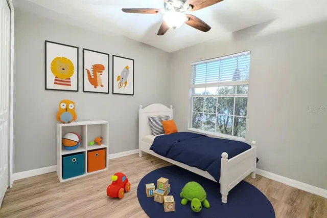 a view of a room with wooden floor and gym equipment