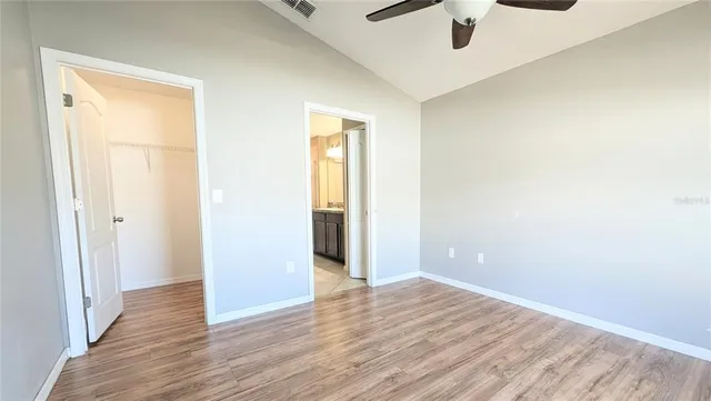 a bathroom with a granite countertop sink a mirror and a shower