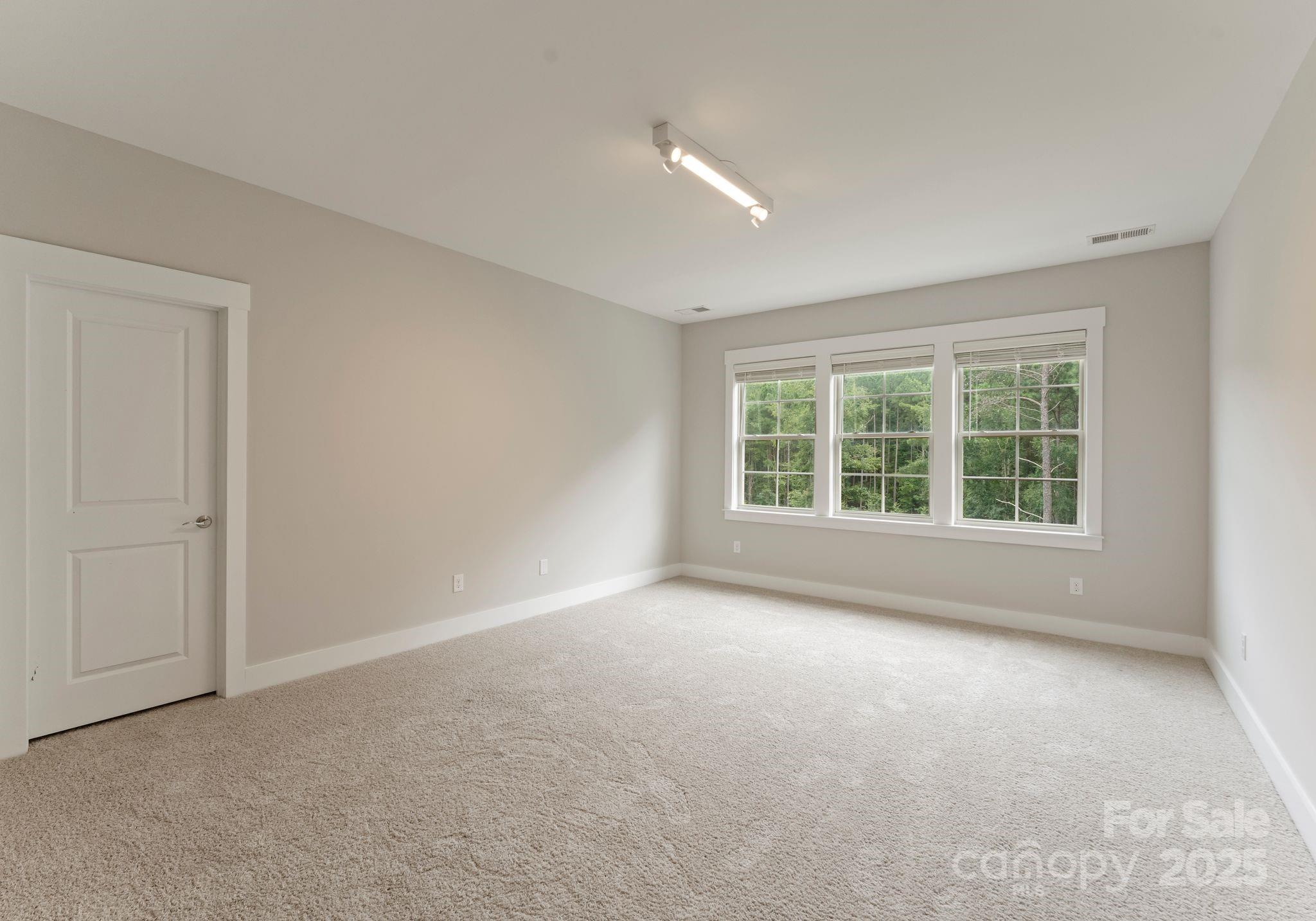 676 Kenway Loop Mooresville, NC 28117 - Photo 31 of 40 a view of an empty room with a window