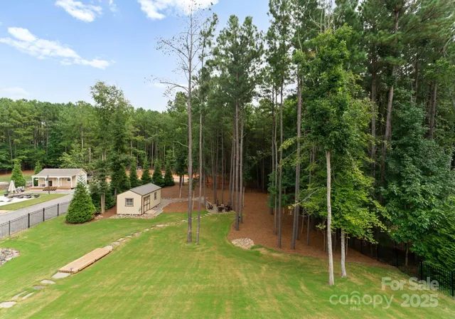 a view of a chair and tables in the garden