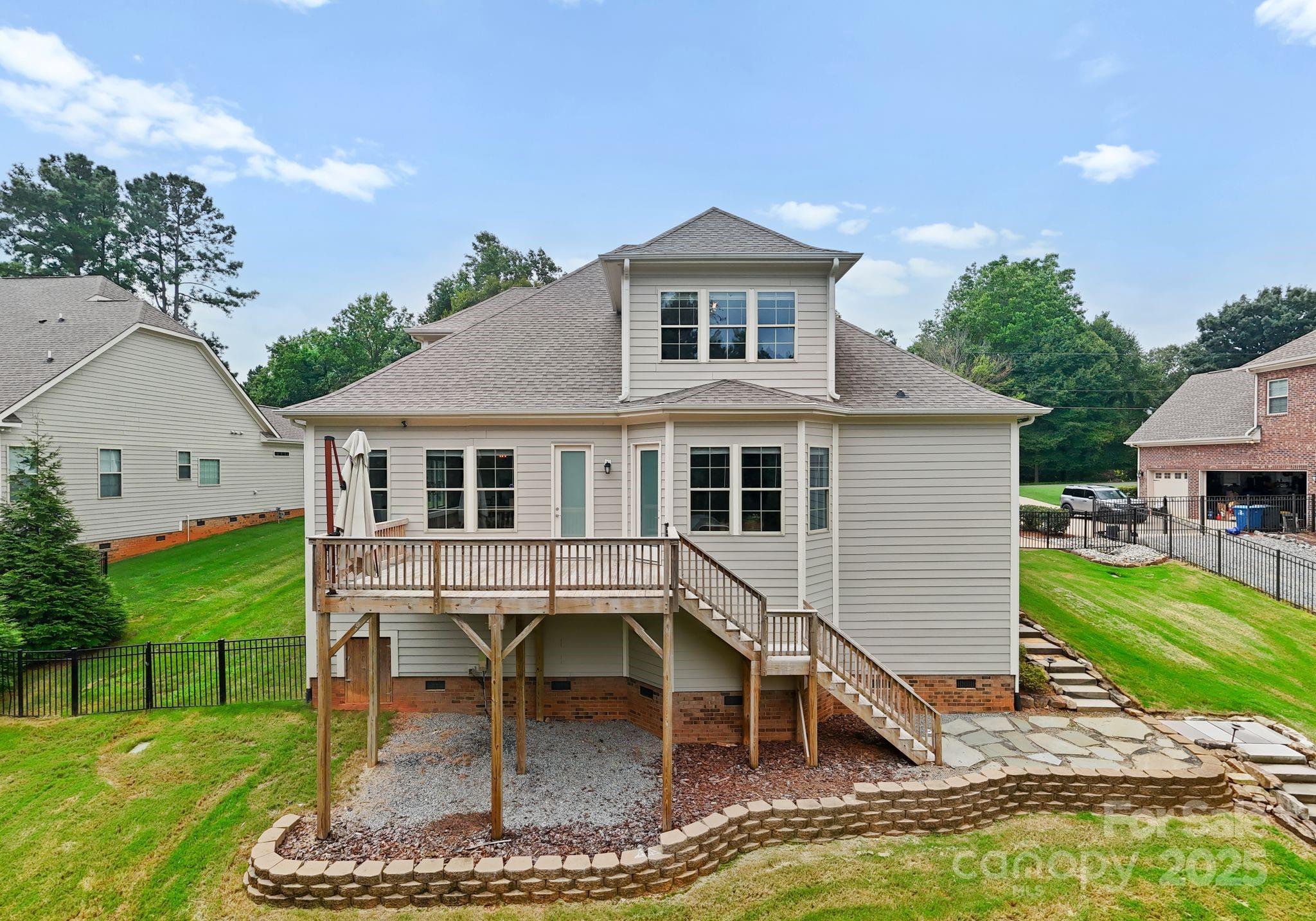 676 Kenway Loop Mooresville, NC 28117 - Photo 39 of 40 a view of a house with a yard