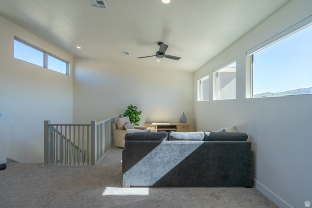 2972 West 570 North Hurricane, UT 84737 - Photo 69 of 104 Living room featuring light colored carpet, plenty of natural light, ceiling fan, and recessed lighting