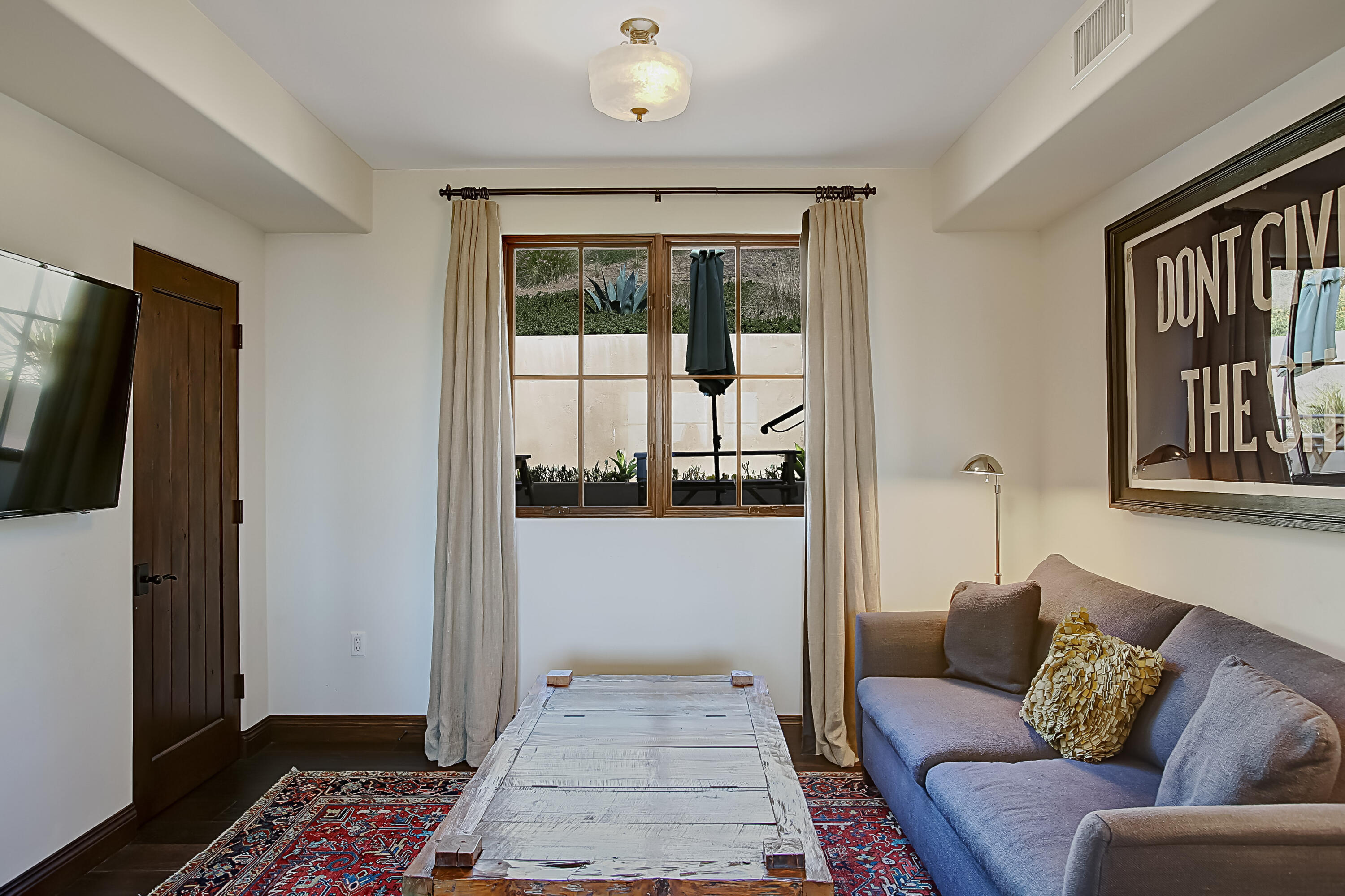 Undisclosed Address Santa Barbara, CA 93109 - Photo 22 of 38 a living room with furniture and a rug