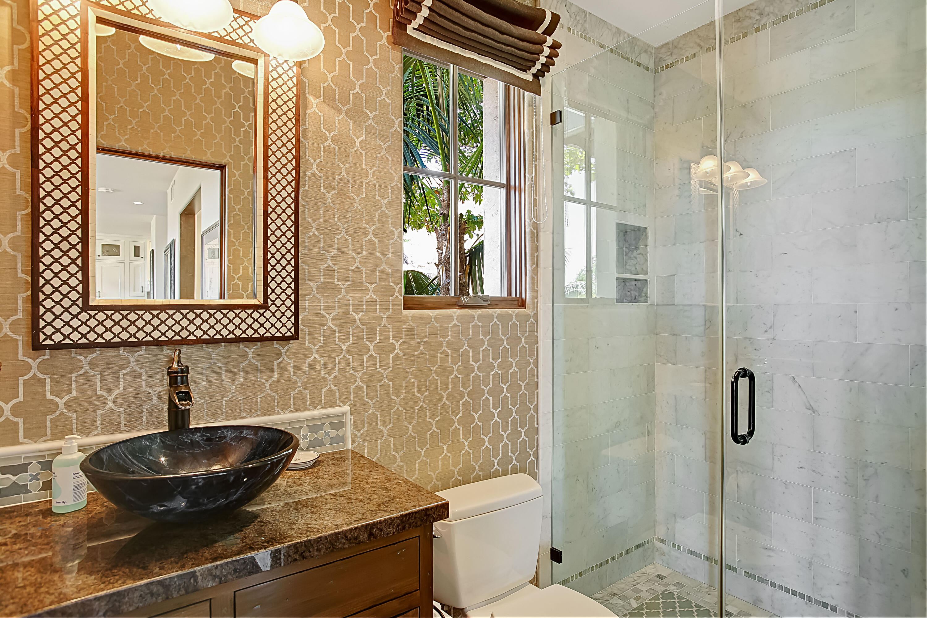 Undisclosed Address Santa Barbara, CA 93109 - Photo 23 of 38 a bathroom with a toilet a sink and mirror