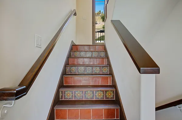 a bedroom with a bed next to a window
