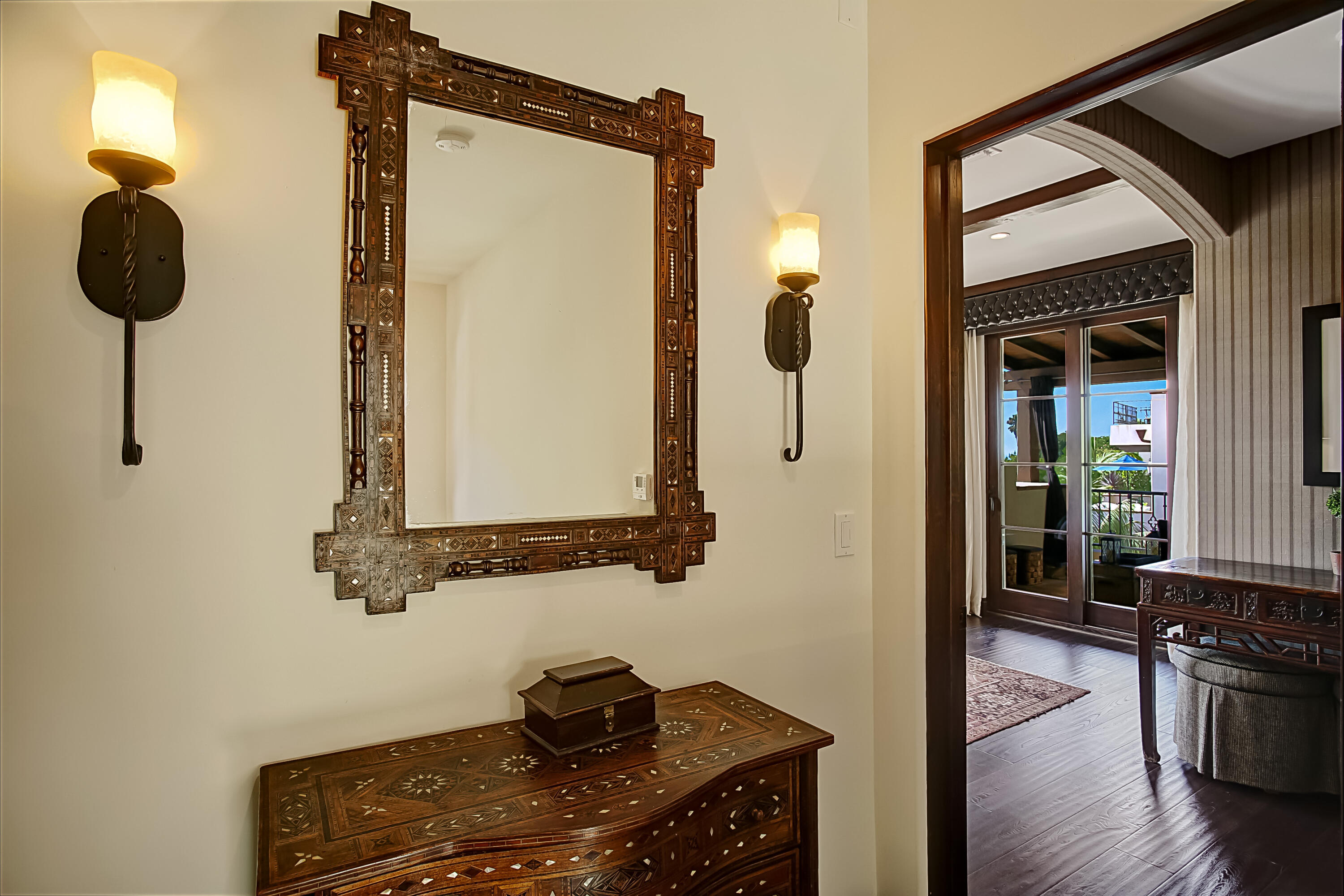Undisclosed Address Santa Barbara, CA 93109 - Photo 26 of 38 a bathroom with a granite countertop sink a mirror and vanity