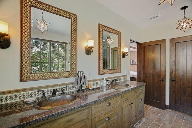 a bathroom with a tub and a shower